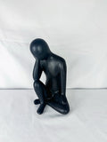 Seated Ceramic Figurine