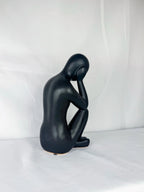 Seated Ceramic Figurine