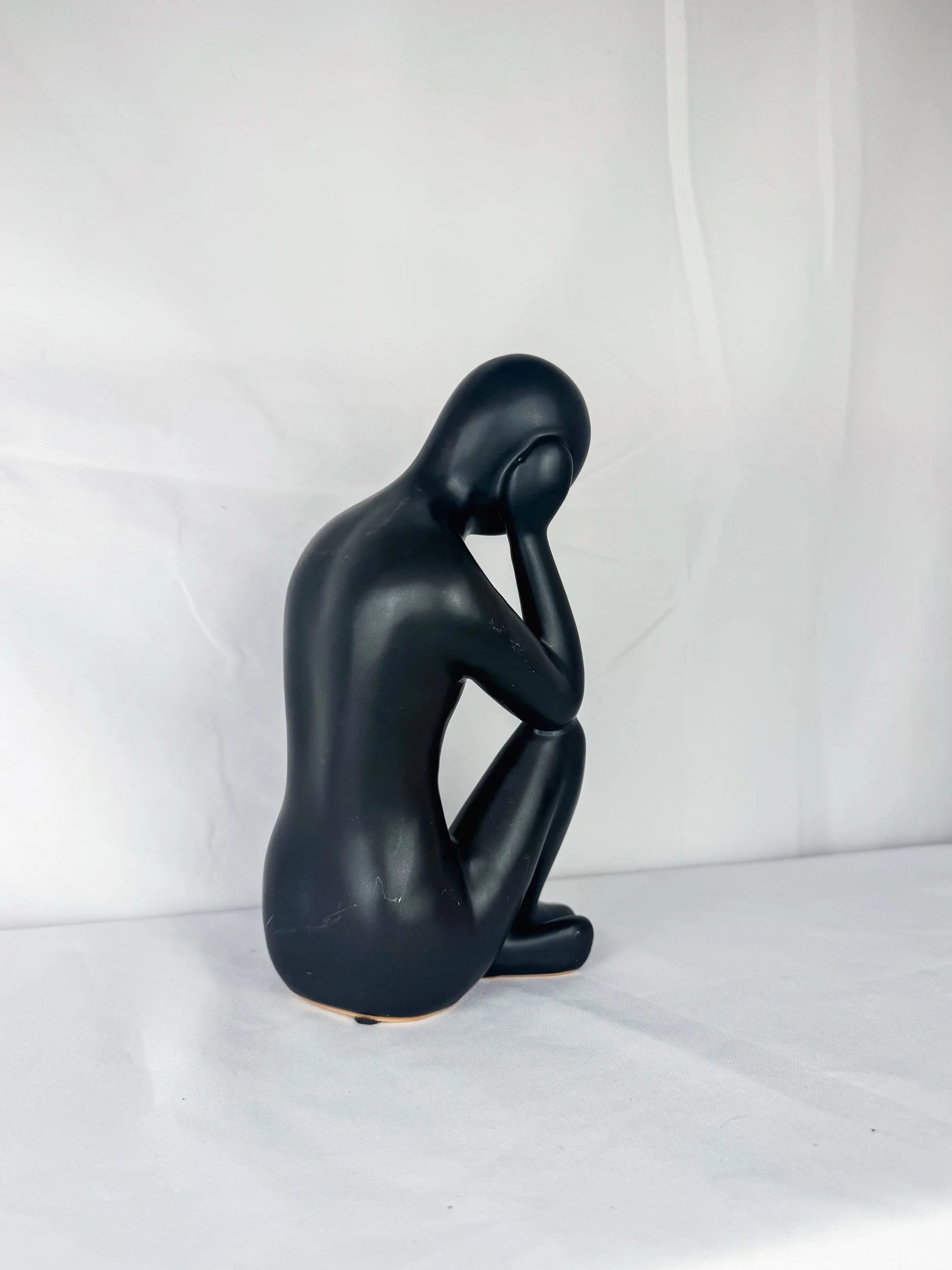 Seated Ceramic Figurine